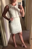 This dress doesn't have stretch and is a little big in the bust area for me, but overall it fits really well, doesn't feel too short, and is SO cute! Planning on wearing it for my bridal shower! - Shannon D.