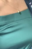Color is beautiful but it will only flatter your body if you are the model in the picture. Don't expect that look. Low quality polyester. - Serena R.