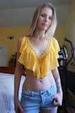 I ordered an extra small. Fits great. I'm not wearing a bra or anything underneath because the ruffles cover up everything. I also paired it with a necklace from Lulus (as pictured). - Karen M.