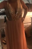 It may just be my body, but this dress didn't fit me like I hoped! I have a shorter torso so it just fell on my body wrong. The bust was loose so that's the main reason it didn't work out for me. I would've had a peep show all night had I kept the dress. You could probably safety pin it or put a tack in it. It's also very long so keep that in mind. Otherwise, the dress was beautifully made and would've been awesome!!! Also, please ignore the messy room in the photo, I wasn't planning on sharing that pic! - Jordan C.