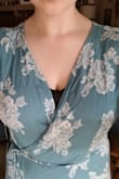 First, I will admit that the color is NOT as shown. It is much more of a muted turquoise than a bright teal. That doesn't bother me since I was concerned that the online photos looked too bright (almost like a Hawaiian shirt). It is also loose in the bust; however, I have no issue adding a discreet button or hook-eye clasp. Besides that, I wouldn't think anyone would have an issue with this dress. It is very flattering for larger hips (defines the waist nicely). The sleeves add some coverage without being boring "sleeves." The slit didn't show when I was standing or walking. It did show when I bent over or knelt, but at those angles it isn't too revealing. Overall, this dress is definitely a keeper!
Added note: it has a slight crepe appearance/texture. It doesn't make it feel cheap though, and I think it will help it not be too apparent if it wrinkles. - Lauren A.