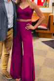 This jumpsuit might be my new favorite thing in my wardrobe. I have never received so many compliments on an outfit before. The magenta color is so beautiful in person. Due to the tightness of the top and the adjustable straps, I didn't have to wear a bra and I ALWAYS have to wear a bra. I'm a tall gal so jumpsuits are usually pretty difficult for me to wear, but these pants hit right at the floor. The only issue I had with it (as other reviews have stated) is that when I sat down, it could be a bit revealing at times. My upper thighs would show almost all the way to my hips. It was fine, but I just had to be very cognizant of it when sitting. I can't wait to wear this again - it's definitely a show stopper! - Laura M.