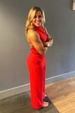 Absolutely love this jumpsuit! I purchased it for a wedding. I received countless compliments. It was a given that I'd get it hemmed.. (About three inches came off - and I kept the pockets.) I wore it with flat sandals but could also do heels. I'm also pretty flat chested but a sticky bra was perfect! Just do it! I want all the colors! - Shannon S.