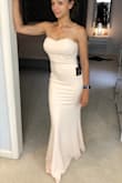 The dress is pretty and fits well. It's a little long even in the XS. The chest is a little bulky. I like the dress but returned it because it wasn't quite what I was looking for. - Sara