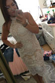 I bought this dress for my bridal shower and was a little hesitant at first. I typically don't do the high cut with collar around the neck. I am SO pleased I took a chance and got this dress! I got so many compliments. It was the perfect fit and looked classy and sexy at the same time! - Kelly M.