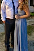 The fit was very flattering and the waist detail was not overly exposing. The dress was well made, the fabric was substantial enough that with the top adjustable straps it was fitted enough not to wear a bra. The dress was long enough to wear a heel with. Would recommend! - Kealy A.