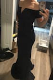I had low expectations for this dress since I was buying it online. But holy smokes! It exceeded all my expectations! The material is thick, slimming, and doesn't show any marks underneath. It fit perfectly, with the beautiful shoulder cut. - Maries A.
