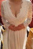I purchased online all the way from New Zealand, I am a size 12-14 on the top with a bra size of 14c and I ordered a large and it fits perfectly, the material does not feel cheap at all and the bottom feels quite weighted which is nice, I will be wearing this as my wedding dress and I am so excited! Shipping was very fast and arrived in two weeks after ordering. - Jasmine F.