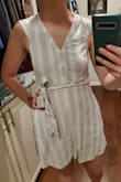 I don't like to wear pants, so I wear a lot of dresses but it can make me seem "dressed up." This dress is perfect for a hangout with friends that doesn't make me look out of place. It's a nice cotton or linen material but that does come with a downside - after washing it needs some attention with the iron. The picture is after washing without ironing. The back is so cute with the peek-a-boo opening. The color, texture and feel of this dress is exactly what I wanted for the summer.. Oh! and POCKETS! - Annastasia R.