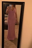 The dress is very beautiful and the material is very nice with a liner. I'm surprised my body fit in a small but after reading the reviews, I noticed that most girls had a small so I went for it and it fit really nice! It's very long tho and I had to have it hemmed. I wore it to a wedding and received many compliments. - Lucy B.