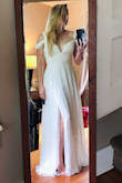 I bought this for my wedding coming up in a few months. I bought a size Small. 
When I put it on and looked in the mirror I was just so overwhelmed with how beautiful it looked and how amazing I felt in it! Like.... MAN, I feel like a woman! For a gal with a smaller bust, it actually gives me just a hint of cleavage. Hooray! The quality is impeccable for how incredibly affordable it is. It flows effortlessly, just screams romance, and I can't love it enough! It's currently being hemmed and I can not wait to wear this on my wedding day!! - Heather G.