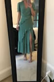 Seriously, it's a beautiful, well made dress. Snug around the waist, but I ordered an xs, I wouldn't size up though because I think the fit is perfect. - Courtney R.