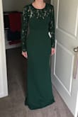 The dress is definitely meant for a 5"10" model so I will have to have it hemmed but otherwise it fits beautifully. I can't wait to wear it to a wedding this fall. - Elaine S.