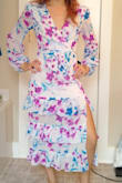 When I saw this dress I fell in love with the colors and the slit. The hip area hugs but isn't 'tight'. I can bend over, squat, and walk without any resistance. I'm torn on how I feel about the layers on the skirt. Torn between it being flowy or too much material for my build. I can wear a regular bra without worrying about it showing in the front. The dress stops about 4 inches above my ankles, which means I don't have to worry about it dragging on the floor if I don't wear heels. Main negative... I can't raise my arms all the way up. I can lift them about half way up and then the material starts to tug. - Crystal C.