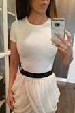 Definitely a cute crop that can go with everything, but if you aren't layering on top of it, beware that the material is on the thinner side (bra cup lines show). I usually wear XS in tops from Lulus but this one has no give. - Angel K.