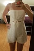 I have always been skeptical when ordering rompers since I have a long torso and shorter legs but WOW is this cute!! I love the cutout in the front. The material is super comfortable and the bottom is a looser fit. I feel comfortable sitting in this romper without it pulling down, and I like the roomier fit on the bottom. I can't wait to wear this during my Bachelorette Party daytime activities! - Kimberly D.