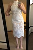 I'm in my late 20's. I couldn't pull this style off, but my mom maybe could. Odd fit, kind of stiff... not stretchy. I wouldn't say this is lightweight, but I wouldn't say it's heavy either. - Kianna G.
