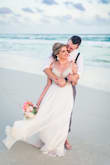 I bought this dress for my destination wedding and it was absolutely stunning on the beach! I received so many compliments from my quests and they couldn't believe the amazing quality for the only $250 price tag! I look at designer dresses and this one was by far the winner. I did have alterations done for the length and to adjust the straps as they were a little long for me. Otherwise the fit was perfect. Do yourself a favor, a buy this dress for your wedding!
Photos by: Megan Morse Photography - Natalie D.