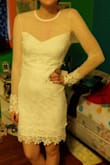 It fits amazing, it's exactly how I imagined it! It's a little shorter than I like. And it is true white, the lighting is what makes it look yellow.
It is a bit see-through so it needs a slip. - Alexys F.