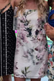 I wore this dress for my bridal shower and I loved it! If you put your arms up, the elastic top part does come off your shoulders, but I had no problem with it. It felt a little big, but it was flowy and comfy so I wouldn't have ordered a smaller size. Perfect for the occasion! - Lexi H.