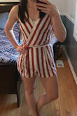 I received a ton of compliments on the romper! I really liked the romper. It appears to be well made and of good quality. However, I ended up having to wear a long sweater with it so that my backside didn't hang out the bottom anytime I did anything other than stand. In the picture it is a little wrinkled from coming right out of the bag, but once it was washed/dried it looked a lot better. - Cate O.