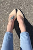 I love these slip ons! The strap fall down sometimes. I may have to get it tightened by tailor, but the shoe stays on regardless. So cute. - Julia M.
