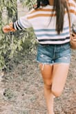 The cutest little sweater!! I'm obsessed with this sweater and it's even cute with shorts. It is a little cropped so if you want it a little bit bigger then size up but I like how it is cropped since I wear a lot of high waisted pants. Love love love. - Natalie N.