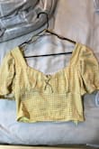 I got the yellow gingham top and it was super adorable, however the only minor thing I don't like is that the colour on the inside is a really bright green yellow colour but you can't see it from the outside, such a cute top though definitely recommend!! - Shana B.