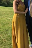 I absolutely loved this dress, ordered it in the mustard yellow color to wear to an outdoor Summer wedding. I was a little unsure about the color but it looked really nice. My only complaint is the dress runs a little big. I was worried the XS would be a too small, but to my surprise it was a little big, especially in the top/bust area. - Stephanie B.
