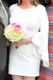 The ivory fabric is wonderfully thick and has a great feel. Overall very well constructed. Everyone loved the tulip sleeves. It's a little short for a wedding but I paired it with Italian fishnets with dots and some simple ivory leather peep toe sandals. - Lily R.