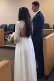 I got this dress for my courthouse wedding. At first I ordered the size small and was worried the waist would be too tight on me (I'm usually a size small or xs, but I'm 16 weeks pregnant so my tummy is a little bigger than normal) it turned out that the whole dress was too big. I returned the small and got the xs and the fit was almost perfect! I had to get the bottom hemmed because I'm short, and then I took up the shoulders a little because there was extra room in the armpits. After that it was almost perfect! The sleeves could have been a little tighter but they didn't hang off my arms or look bad. I have to say for the price and how quick it got delivered it was the perfect pick for my small wedding! - Stevie E.