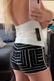 The white top is super cute and comfy. One thing is that you can see a little through it so you have to wear something to hide your breasts.
The quality is good and you have a second button coming with the label. - Jaquelyn D.