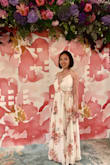 Wore this to a summer wedding. Loved it. Got a lot of compliments. It's too long for my height, so I had to take it in for hem, but it's worth it. 
The button in front busted open several times, but it's unnecessary, so left it open for the rest of the night. - Liming S.