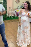 I ordered this dress for my baby shower, I was 33 weeks pregnant (I'm now 35 weeks) and it was perfect! The only downside was the length, I'm only 5'1" and of course I didn't wear heels so it fit me long. I really like that the straps were adjustable, I had to order a large due to my belly but I'm small when it comes to my bust so it helped with keeping the girls in and not having an accident. It was such a comfortable dress, I received so many compliments on it.
Note: The pictures with the champagne glass was non-alcoholic apple cider. And I tried picking pictures to show off the dress entirely. - Jennifer C.