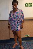 This romper is super colorful and right up my alley. The neckline gives enough cleavage and the shorts part isn't too short. Ordered it for my June cruise. Definitely a showstopper. Wore it after dinner on my cruise. Got soooooo many compliments. Wore it on deck, to the comedy club and nightclub. Absolutely beautiful pattern. You can wear it opened at the top or snapped close. Do not pass this up! - Marsha M.