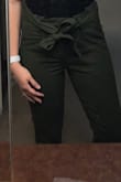 These are cute! They're a little more cropped than I expected, a little more than in the models picture but still really cute. It has two buttons and a zipper to keep the pants tightly closed and then the bow to tie in front! Happy with my purchase. - Nina E.