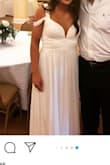 I ordered this dress in case I wanted to change during the reception of my wedding. At first I ordered the medium and it wouldn't zip all the way over my rib cage. I loved it so much that I had a large one overnighted to me and am so glad I didn't just send it back. I got many compliments and it was super comfortable and pretty. The large is two inches bigger than the medium which was a little more than I needed but it still worked. I did have to have about 4 inches cut off to wear with flat shoes. Overall it's a super cute dress! - Ashtyn M.