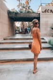 This dress is perfect for summer. The cut is flattering and the material is so soft and breathable. The tassel detail on the hem is so cute. I bought in orange and it's very complimentary on all of my girlfriends different skin tones. - Alyssa T.