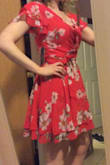 This dress is super cute and flowy. I really liked it but unfortunately I'll be returning it because the bust didn't fit correctly. It was gaping a little under the clip that kept it closed, even when I wore a bra that flattened me out a little. The rest of the dress fit perfectly and was super cute. I wish i could make this work but you could see my bra where it was gaping and this won't really work with a top underneath. - Rose B.