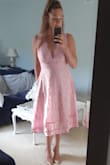 Runs a little large. I wish I had have ordered a small, but the Medium is fine. Beautiful dress, shipped quickly, I love it. - Jennifer J.