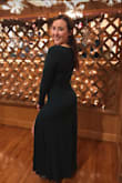 Loved this dress. Wore to a wedding and the bride asked if she could borrow it! Husband couldn't keep his hands off. It definitely clings - I probably should've gotten some spanx to smooth out the tummy fat - but it also hugs the curves. I wore with wedge booties and did not need to alter. - Delaney L.