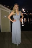 I ordered this dress in a medium and it was big in the chest area and there was too much material. I was hesitant in ordering a small since I'm so tall and I'm not a small, but I'm glad I did. The small fit perfectly. Without heels, it dragged on the floor a little. When I wore the dress with a 2" heel, it was off the floor. This dress complimented my curves in the best way! - Camryn D.