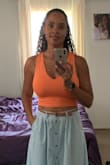 Super cute top. I got a medium and it fits tight but I wore a bra under it since I have large breasts. - Marsha J.