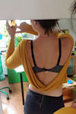This model is super short (seriously, almost a crop top). So only with very high waisted pants or skirts. Otherwise, you will show your belly. More than on the model. Color and fabric are really nice, although a bit darker in real life. I will add a simple ribbon for the neck; otherwise, it falls off the shoulders way too much.
Overall nice and funky top. - Marjoleine K.