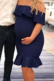 Wore this dress at my baby shower and received so many compliments! I loved it. I normally wear a medium, but I sized up because of the bump. It is stretchy and fit perfectly. After a few hours of wearing it, the zipper split (good thing the event had just ended). Obviously the bump could have caused it, but because it was super stretchy and I didn't have a problem zipping it, I didn't think that would happen.

But either way, super cute. - Maya A.