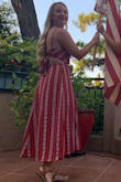 I wore this dress on the 4th of July and received so many compliments. The fit is TTS. If you are a more busty gal its a great dress because you can tie the top in the back more loosely and the straps are adjustable. The dress is lined and has two small slits in the front. The pattern on the dress is very flattering. I have no bad things to say about this dress. Buy It!! - Alexandra F.