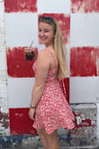A fun summer dress! Love the bright red and has a fun back. It is pretty short, so if you are a tall girl it may be too short. Also the chest area is a little tighter than I like. - Alexandra F.