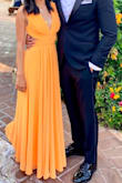I ordered this dress for a summer black tie wedding! This color is definitely a standout, but also very unique and unlike anything else I own. I ended up hemming the bottom of the dress about 2.5 inches, so it would just skim the ground. It was also worn with a 3 inch heel. I am very pleased with my purchase! - Brandi W.