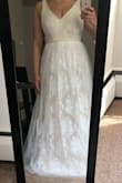 This dress looks like a wedding dress. It's super cute. I love the colors used (white and a pinkish color). Very flattering on and comfortable. Oh, love how pretty the belt/sash is! - Kianna G.