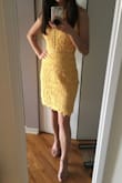 This dress is gorgeous. Material is thick and high quality and is form fitting without being scandalous. My only two qualms are that the middle and vertical circle cutout/trim has absolutely NO give. Also bought an XS in both yellow and light blue and the light blue fit significantly tighter than the yellow. Good thing I preferred the yellow dress. If you're in between sizes, definitely size up. - Connie H.